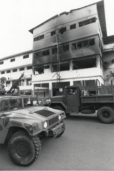 A HMMV parked in from of Comandancia. Vehicles