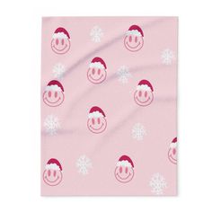 a pink towel with snowflakes on it and a smiling face in the middle