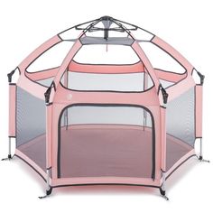 a pink baby playpen with the door open