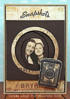 a card with an image of two people and the words snapshots on it