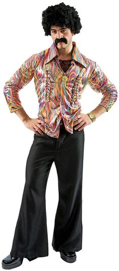 a man with an afro is posing for the camera while wearing black pants and a colorful shirt