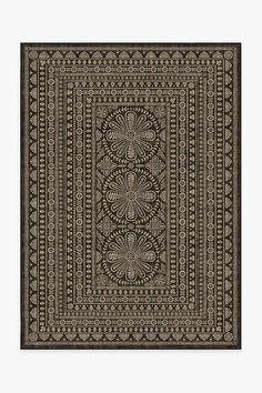 a black and white rug with an intricate design