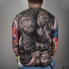 the back of a man with tattoos on his body