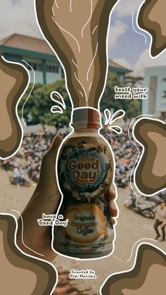 a person holding up a bottle with the words good day on it