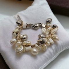 Chico's Jill Bracelet White Shell Pearl Beads Braided Magnet Closure New With Tag 7" New Old Stock - Tag Attached But It Has Been Cut - See Photos For Details Ready To Wear, Give As A Gift Or Add To Your Collection! Many Of My Items For Sale Are Treasures From The Past And May Reflect Both History And Age. Please Enlarge Photos For Detailed Condition Of Each Item. Email Any Questions You Have Prior To Purchase And Thank You For Looking! Elegant Hand-strung Beaded Bracelets For Beach, Elegant Adjustable Mother Of Pearl Beaded Bracelets, Adjustable Cream Pearl Beaded Bracelets, Adjustable Cream Pearl Beaded Bracelet, Bohemian Pearl Beaded Bracelets In Silver, Bohemian Silver Pearl Beaded Bracelets, Elegant Handmade Mother Of Pearl Beaded Bracelets, Adjustable White Mother Of Pearl Beaded Bracelets, Adjustable White Beaded Mother Of Pearl Bracelets