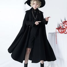 A long cloak for a prestigious black knight. Pair it with blouse and pants to create a boyish black knight outfit. Just put on a cloak to create a full atmosphere. Why not be invited into the world of knightly tales? 
 
 
 Size 
 
 S size 
 
 Length: 120cm 
 
 M size 
 
 Length: 124cm 
 
 L size 
 
 Length: 128cm 
 
 
 
 
 
 
 
 
 Material 
 
 Wool 
 Polyester 
 
 
 Model worn 
 
 Wearing size 
 
 S size 
 
 Model dimensions 
 
 Height: 160cm Gothic Outerwear For Fall Fantasy Events, Gothic Outerwear For Fantasy Events In Fall, Gothic Black Outerwear For Halloween, Gothic Black Halloween Outerwear, Black Gothic Outerwear For Halloween, Gothic Cape Outerwear For Costumes, Black Long-sleeved Dark Academia Outerwear, Gothic Cape Outerwear For Costume Party, Gothic Cape For Costume Party In Fall