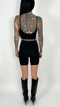 We love a solid biker short action. Super stretchy and comfy and holds errrrthang in. These babies are ribbed (for her pleasure). IYKYK. Just a little added touch to take a basic biker short to the next level. Perfect to pair with your favorite oversized graphic tee or under a mini dress so your kitty isn't saying hi to everyone. Fit: True to size Model is: Height: 5'6" Waist: 25” Hips: 31.5" Chest: 32C Wearing size S/M Material: 92% Nylon 8% Spandex Paired with: Valencia V Brami Apparel size ch Trendy High Stretch Biker Shorts For Loungewear, Sporty Fitted Biker Shorts For Loungewear, Seamless Stretch High-waisted Biker Shorts, Trendy Workout Tops With Built-in Shorts, High Stretch Biker Shorts For Loungewear, Flexible Biker Shorts For Loungewear, Sporty Stretch Short Top, Trendy Solid Biker Shorts For Gym, Trendy Plain Biker Shorts For Gym