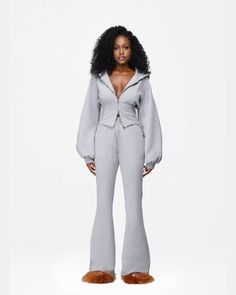 Detailed with a cinched waist and dramatic sleeves, the Courtni Hoodie stands above the rest. She brings the Hanifa boldness to your most casual outfit, and is a timeless addition to your comfort wardrobe. Pair with our Courtni Flare Sweatpants to complete the look. Product Details Extra wide ribbed waistband 2-way Zip Lounge Wear Aesthetic, Flared Sweatpants, Flare Sweatpants, Dramatic Sleeves, Fit Clothes, Brand Mood Board, Vacation Mood, Fashion Vibes, Simple Fits