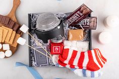 an assortment of candy, marshmallows, and other items on a tray