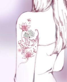 the back of a woman's shoulder with flowers on it