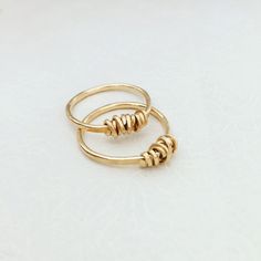 "A beautiful wire wrapped 14k gold filled ring. This delicate handmade gold filled ring with a special wire wrap texture at the top has a chic and sophisticated look. This ring looks great as a minimalist single piece, but will look even better when layered with other rings. This ring is made from high quality 14K \"Gold Filled\" - unlike \"gold plating\" the gold in gold filled jewelry is mechanically bonded to the base metal, and it will not wear off or turn black. This ring literally goes wit Delicate 14k Gold Filled Midi Rings For Gift, 14k Gold Filled Open Midi Rings As Gift, Simple 14k Gold Filled Midi Rings For Gift, Delicate 14k Gold Filled Midi Rings As Gift, Simple 14k Gold Filled Midi Rings As Gift, Simple 14k Gold Filled Midi Rings For Anniversary, Dainty Brass Stackable Rings For Anniversary, 14k Gold Filled Stackable Rings As Gift, Simple Design Gold Stackable Rings As Gift