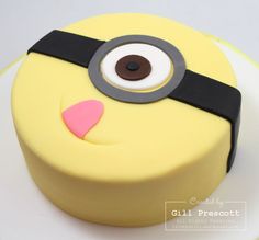 a yellow cake with a black and white eyeball on it