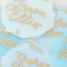 blue and white cake toppers with gold lettering