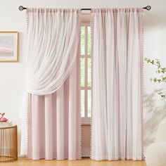 the curtains in this room are pink and white