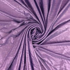 a close up shot of the fabric in purple color, it is very soft and shiny