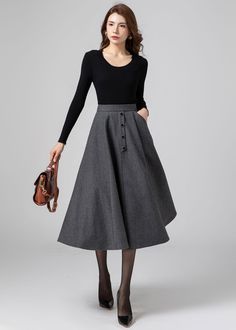 "★★FEATURE Wool blend fabric Polyester lining Fitted waist Two pockets Button decoration in front Back zipper closure A-Line wool skirt Perfect for winter, autumn Dry clean ★★Mode size Height 170 cm (5′ 7″)  Bust 84 cm (33\")  Waist 66 cm (26\")  She wears size XS ★★ Please select custom order according to the follow situation Your height is not between 155 cm- 172 cm Your weight is over 75 kg Request the length ★★ Get your size in Size Chart with your body measurement https://www.etsy.com/listi Knee-length Wool Skirt For Winter, Wool Full Skirt With Lining, Retro A-line Winter Skirt, Chic Wool A-line Skirt, Winter Wool A-line Skirt, Winter Wool Skirt, A Line Midi Skirt, Skirt Winter, Skirt Wool