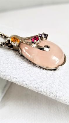 "This VINTAGE PENDANT is made with a Large PINK QUARTZ DROP enhanced with semi-precious prong set faceted stones set in Sterling Silver ( 925 ) I think the piece is Handcrafted but I could be wrong---you decide. The heavy chain is marked 925 on the clasp & is 22\" long ( for all sizes see photos ) This pendant is VERY GOOD-EXCELLENT VINTAGE CONDITION . Questions ? Please call 1-207-865-6191." Pink Gemstone Accents Necklaces For Formal Occasions, Formal Pink Necklaces With Gemstone Accents, Formal Pink Gemstone Accented Necklaces, Elegant Pink Multi-stone Necklace, Fine Jewelry Pink Multi-stone Necklace, Pink Gemstones In Fine Jewelry Style, Fine Jewelry Pink Multi-stone Jewelry, Pink Multi-stone Gemstones For Gift, Fine Jewelry Pink Stone Setting Jewelry