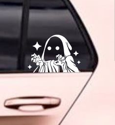 a sticker on the side of a car that has a nun holding a star