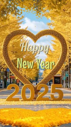 a happy new year card with a heart shape in the middle and yellow leaves on the ground