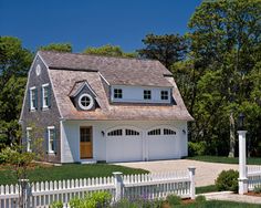 a house with a white picket fence around it