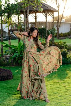 Introducing our exquisite Pista Green Embroidered and Printed Anarkali Suit Set, crafted with utmost care and attention to detail. The georgette base suit features intricate saadi and moti hand embroidery, adding a touch of elegance and sophistication to your wardrobe. The suit set comes with a matching printed flared sharara pants, perfectly complementing the overall look. Dress to impress at any occasion with this stunning anarkali suit set. Anarkali With Sharara, Round Neck Anarkali, Floral Print Anarkali, Printed Anarkali Suits, Black Anarkali, Georgette Anarkali Suits, Green Anarkali, Sharara Pants, Georgette Anarkali