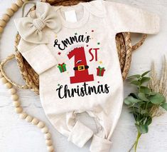 Personalized Baby Romper: Celebrate Your Baby's First Christmas in Style Celebrate your baby's first Christmas in style with our Personalized Christmas Neutral Baby Romper. This soft and comfortable outfit, available with a bow or hat, features charming motifs like "My 1st Christmas" and can be personalized with your baby's name. Perfect for capturing precious newborn pictures, it also makes an adorable coming-home outfit or a thoughtful baby shower gift. With footies for extra warmth, this romp Christmas Onsies, Christmas Baby Romper, Christmas Neutral, My 1st Christmas, Xmas Outfit, Thoughtful Baby Shower Gifts, Christmas Romper, Comfortable Outfit, Outfit Christmas