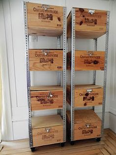 two wooden boxes are stacked on top of each other in the corner of a room