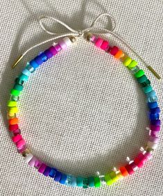 "This bright & FUN neon rainbow glass pony bead necklace is guaranteed to add a pop of happy to your day!!  The length can be adjusted from 17\" to 30\".  Just simply untie the cord and adjust the necklace to whatever length the occasion calls for.  Great by itself and also fun to layer with other necklaces!!  You can also rearrange the beads if you want to change it up for fun!!   Handmade with high quality glass and enamel beads.   Please specify silver beads with aqua cord or gold beads with Pony Bead Necklace, Enamel Beads, Rainbow Glass, Neon Rainbow, Pony Beads, Gorgeous Necklaces, Gold Beads, Bead Necklace, Chain Styles