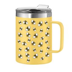 a yellow travel mug with bees on it