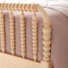 a close up of a wooden bed frame