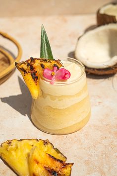 a pineapple and coconut drink on a table