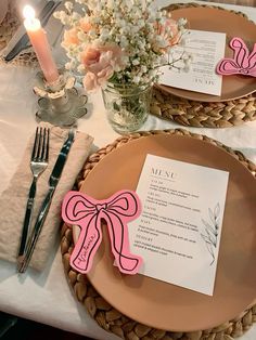 the table is set with place settings for two people to sit down and have their names on them