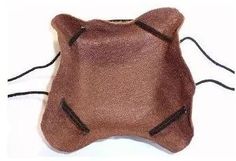 a brown cat shaped pillow with zippers on it's sides and eyes closed