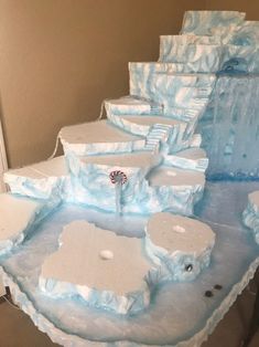 there are many ice blocks on the floor and one is made to look like an ice castle