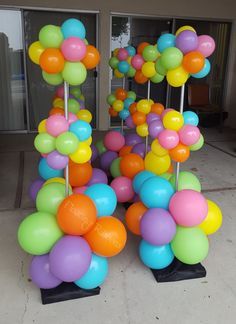 there are many colorful balloons on the ground