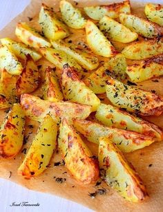 the potatoes are seasoned with herbs and seasoning on top, ready to be eaten