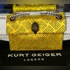 This Bag Is Brand New Dimensions: 7¾"W X 5¼"H X 2¼"D Material Is Textile Comes With A Kurt Geiger Dust Bag Designer Gold Shoulder Bag With Dust Bag, Designer Gold Bags With Branded Hardware, Luxury Gold Bags With Branded Hardware, High-end Gold Bag With Chain Strap, Luxury Gold Bag With Chain Strap, Designer Gold Clutch Shoulder Bag, Gold Party Bag With Branded Hardware, Luxury Gold Top Handle Evening Bag, Designer Gold Shoulder Bag For Evening