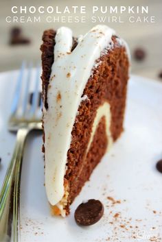 a slice of chocolate pumpkin cream cheese swirl cake on a white plate with a fork