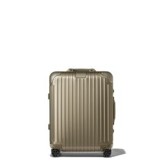 a brown suitcase on wheels against a white background