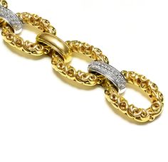 Krypell Gold Diamond Heavy Wide Link Bracelet This Charles Krypell bracelet showcases an elegant composition of ornate 18K yellow gold, crafted with precision to form a series of sumptuous links that catch the light with every movement. This piece is a striking example of craftsmanship and luxury, perfect for enhancing any ensemble with a rich, opulent touch. Whether worn as a statement piece or paired with other fine jewelry, it promises to be a captivating addition to any collection. Bracelet Luxury Diamond Chain Bracelet With Rectangular Links, Luxury Ornate Collectible Bracelets, Luxury Chain Link Bracelets With Box Clasp, Luxury Yellow Gold Ornate Bracelets, Luxury Statement Diamond Bracelet In Yellow Gold, Luxury Yellow Gold Ornate Bracelet, Luxury Statement Yellow Gold Diamond Bracelet, Luxury Antique Yellow Gold Chain Bracelet, Luxury Hallmarked Vintage Chain Bracelet