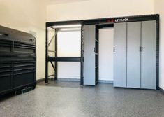 an empty storage room with several metal lockers