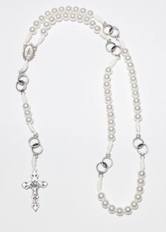 Wedding Rosary, Wedding Ring Bride's Rosary For Blessed Marriage White Pearl on Cord, Wedding Ring Rosary This is the most beautiful wedding rosary. It is made of white pearl connected whit chain. There is 6 wedding rings beads. Rosary is quality made with the special cross. Rosary is 52 cm or 20,47 inches long. White Cross Jewelry With Pearl Drop, First Communion Pearl Drop Jewelry, Pearl Charm Jewelry For First Communion, Wedding Silver Pearl Rosary, Elegant White Cross Rosary, Pearl White Rosary For First Communion, White Pearl Rosary For Baptism, Beaded Cross Jewelry For First Communion, Cross-shaped Beaded Jewelry For First Communion