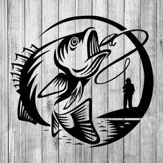 a fish with a fishing hook on it and a man standing in the water next to it