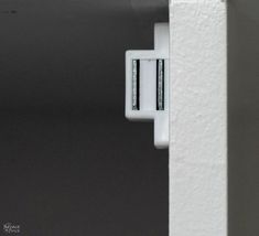 an electronic device is attached to the side of a wall