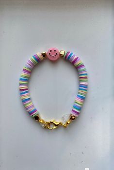 a bracelet with a smiley face on it