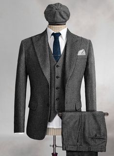 Every man needs to add a tweed suit to their wardrobe this winter. Go for our Arthur Shelby Peaky Blinders Gray Tweed Suit which provides warmth and helps you create a look like your favorite character Arthur Shelby from Peaky Blinders. Crafted from wool, our tweed suit features a flattering and unique weave that helps you transform your outfit and create a cool, casual look that is definitely meant to give you a good time. Elegantly style the suit inspired by Arthur Shelby, brother of Thomas Shelby from Peaky Blinders, and do not be afraid to dare a little.

Look Includes
Vintage Gray Macro Weave Tweed Fabric
Two Button Jacket Style
Classic Wider Peak Lapel (4.75")
Single Vent
Three Cuff Buttons
Two Pleat Style
Two Welted Back Pockets on Trousers Gray Tweed Suit, Gangster Suit, Arthur Shelby, Brown Tweed Suit, Grey Tweed Suit, Peaky Blinders Suit, Tweed Sport Coat, Tweed Suit, Stylish Suit