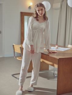 Editor's NotesBALCONY's Belleza pajama set. Pajama set with a soft texture and smocking detail. The pajama set has lace detail that creates a romantic mood.                          - Belleza pajama set- Has smocking detail- Has lace detail- Has a soft textureMeasurements (inch)Top (M/L)- Length: 22.4/23.4 inch- Chest: 16.5/17.5 inch- Sleeve: 23/23.4 inchBottom (M/L)- Length: 37.8/38.7 inch- Rise: 12/12.4 inch- Hips: Feminine Long Sleeve Sleepwear For Loungewear, Feminine Long Sleeve Sets For Daywear, Feminine Sleepwear With Lace Trim For Relaxation, Feminine Sleepwear With Long Pants For Pajama Party, Feminine Long Pants Sleepwear For Pajama Party, Casual Loungewear Sets With Lace Trim, Feminine Cream Sleepwear For Bedtime, Beige Long Pants Sleepwear For Loungewear, Cream Loungewear Sets For Spring