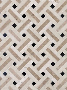 a tile floor with black and white squares on it's sides, in the shape of a chevron herringbone pattern