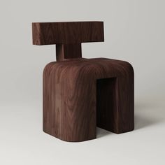 the wooden chair is made out of wood and has an unusual shaped structure that looks like it