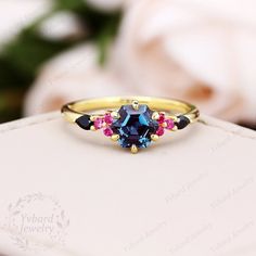 "Please confirm your US size when you make an order) ❤Jewelry Details -Gold Type: Solid 10K Gold / Solid 14K Gold / Solid 18K Gold (Choose One in Material Option) Center Stone: Natural London Blue Topaz, approx. 1.25ct Stone Size: 6*6mm Cut: Hexagon Cut Side Stones: Natural Ruby, Natural Black Sapphire Total weight: 0.22ctw Band Width: Approximately 1.5mm SKU: YR0623 ~*-*~Purchase Guarantee: - All our jewelry is handmade, and each process is refined. - 14 Day Refund Guarantee. - All our products Multi-stone Sapphire Topaz Ring For Wedding, Sapphire Topaz Ring In 14k Gold For Wedding, Wedding Multi-stone Emerald Cut Topaz Ring, Octagon Sapphire Birthstone Ring For Anniversary, Octagon Sapphire Ring Birthstone For Anniversary, Octagon Sapphire Ring For Anniversary, Wedding Topaz Octagon Ring With Diamond Cut, Wedding Sapphire Topaz Ring In 14k Gold, Octagon Diamond Cut Topaz Ring For Wedding